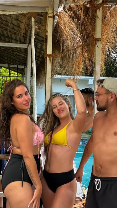 Guests hanging out by the pool at Gaia, Morjim