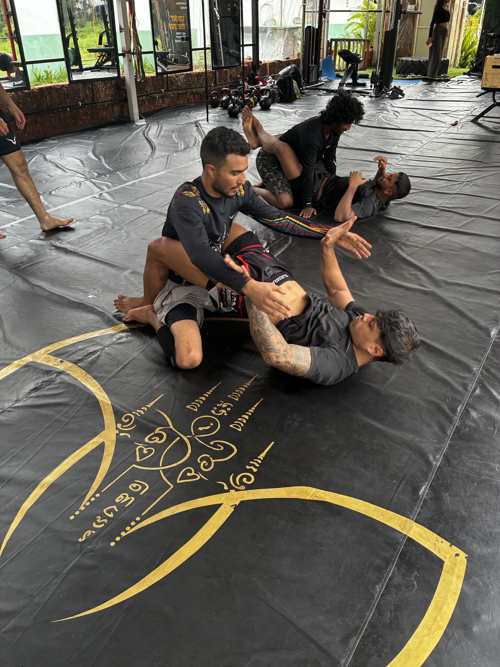 BJJ rolling on the mats at Gaia Fit Lab