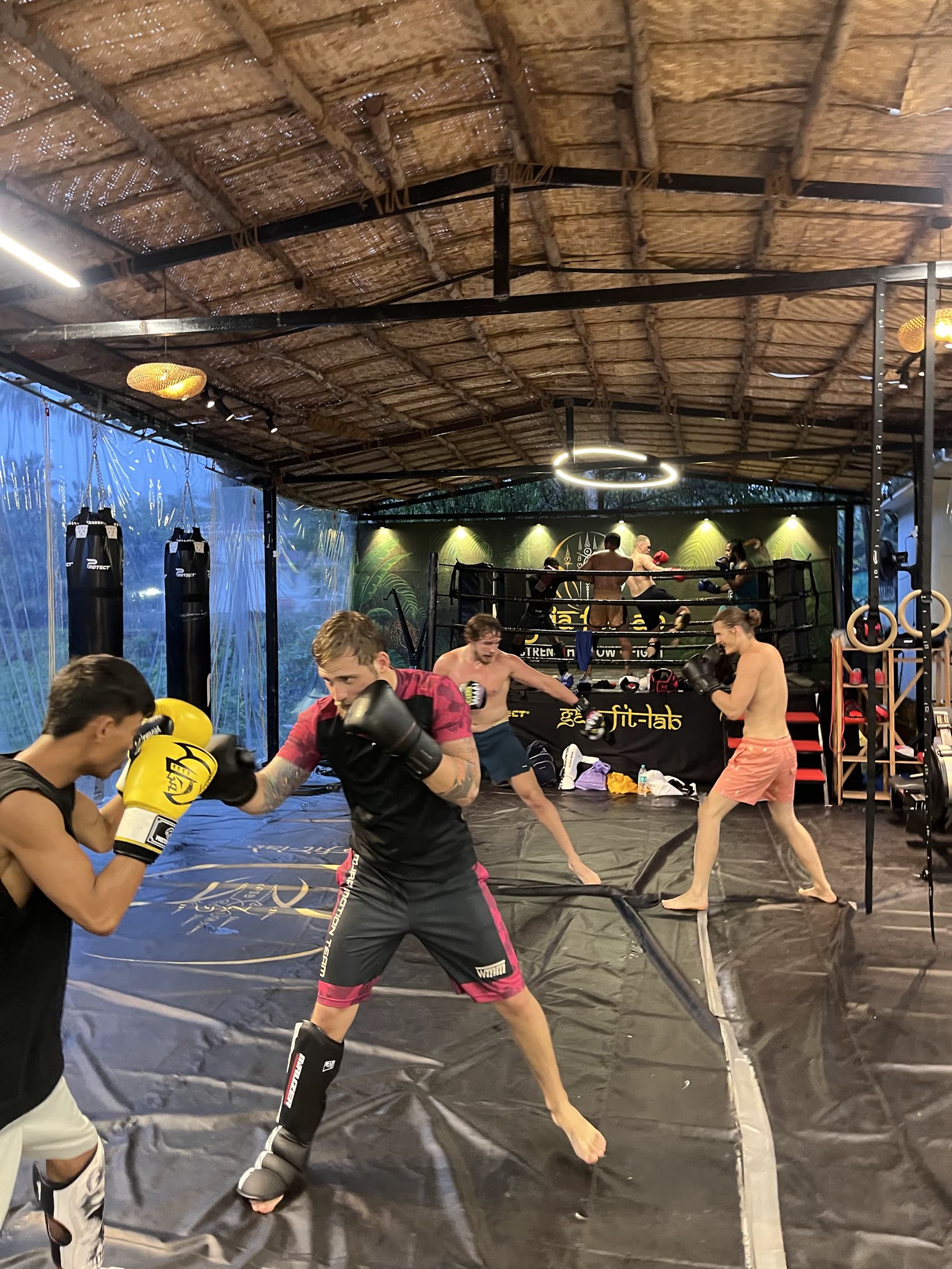 Full class running sparring drills with shin guards at Gaia Fit Lab